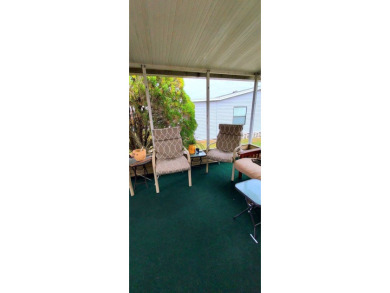 55+/1989/2 BD/2 BA/800 SQ FT/NEW FLOORING/LARGE SCREENED LANAI on Zephyrhills Municipal Golf Course in Florida - for sale on GolfHomes.com, golf home, golf lot