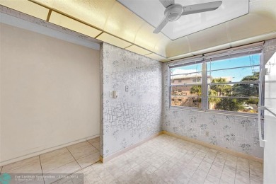 Deluxe Spacious Corner, Screened  Enclosed Balcony with Lake on Wynmoor Golf Course in Florida - for sale on GolfHomes.com, golf home, golf lot