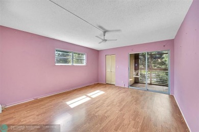 Deluxe Spacious Corner, Screened  Enclosed Balcony with Lake on Wynmoor Golf Course in Florida - for sale on GolfHomes.com, golf home, golf lot