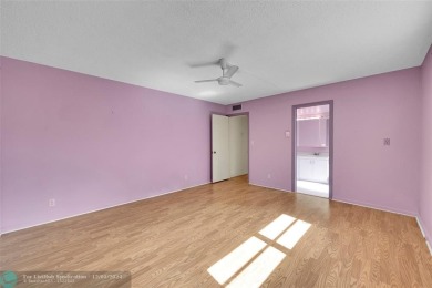 Deluxe Spacious Corner, Screened  Enclosed Balcony with Lake on Wynmoor Golf Course in Florida - for sale on GolfHomes.com, golf home, golf lot