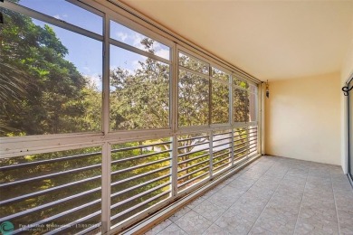 Deluxe Spacious Corner, Screened  Enclosed Balcony with Lake on Wynmoor Golf Course in Florida - for sale on GolfHomes.com, golf home, golf lot
