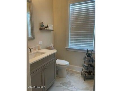 Experience luxury coastal living in this custom 4 bedroom-3 1/2 on Sea Trail Golf Resort in North Carolina - for sale on GolfHomes.com, golf home, golf lot