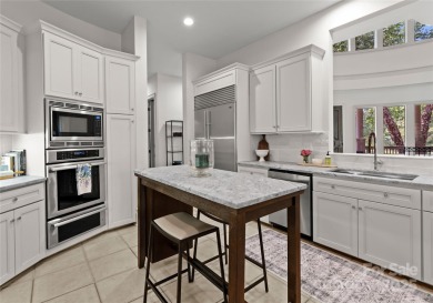 Escape to this sleek 5 bed, 4.5 bath two story contemporary home on Carmel Country Club in North Carolina - for sale on GolfHomes.com, golf home, golf lot