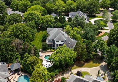 Escape to this sleek 5 bed, 4.5 bath two story contemporary home on Carmel Country Club in North Carolina - for sale on GolfHomes.com, golf home, golf lot