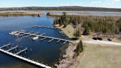 This beautiful wooded building site in one of Indian River's on Indian River Golf Club in Michigan - for sale on GolfHomes.com, golf home, golf lot