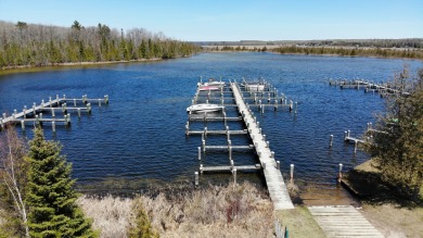 This beautiful wooded building site in one of Indian River's on Indian River Golf Club in Michigan - for sale on GolfHomes.com, golf home, golf lot