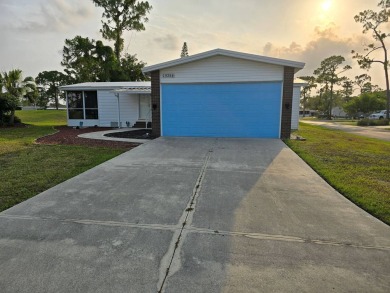 This lovely 2-bedroom partially furnished home on a corner lot on Pine Lakes Country Club in Florida - for sale on GolfHomes.com, golf home, golf lot