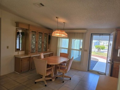 This lovely 2-bedroom partially furnished home on a corner lot on Pine Lakes Country Club in Florida - for sale on GolfHomes.com, golf home, golf lot