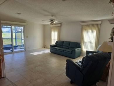 This lovely 2-bedroom partially furnished home on a corner lot on Pine Lakes Country Club in Florida - for sale on GolfHomes.com, golf home, golf lot