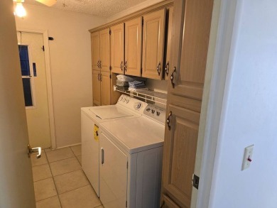 This lovely 2-bedroom partially furnished home on a corner lot on Pine Lakes Country Club in Florida - for sale on GolfHomes.com, golf home, golf lot