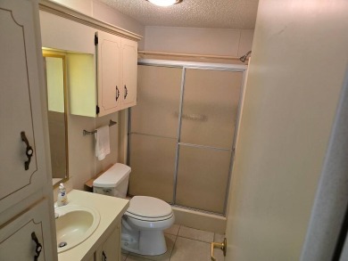 This lovely 2-bedroom partially furnished home on a corner lot on Pine Lakes Country Club in Florida - for sale on GolfHomes.com, golf home, golf lot