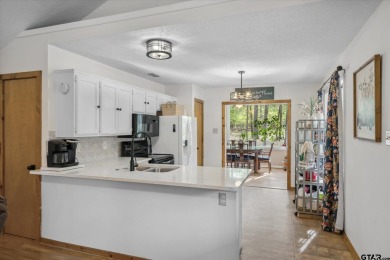 Beautifully maintained home in gated community. The cute covered on Holly Lake Ranch Golf Club in Texas - for sale on GolfHomes.com, golf home, golf lot