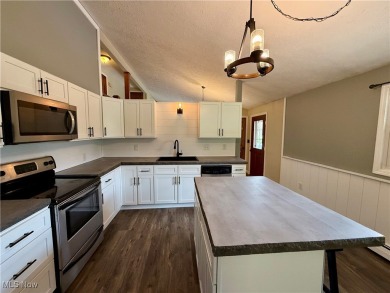Beautifully Crafted Split-Level Home in Lake Mohawk! Come see on Lake Mohawk Golf Club in Ohio - for sale on GolfHomes.com, golf home, golf lot