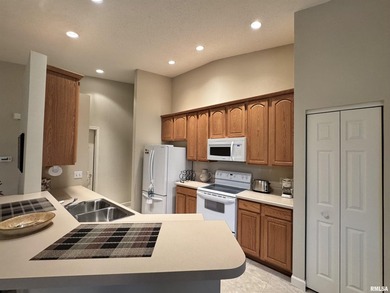 This duplex is located on fairway 15 at the Macomb Country Club on Macomb Country Club in Illinois - for sale on GolfHomes.com, golf home, golf lot