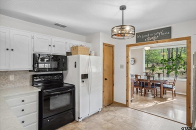 Beautifully maintained home in gated community. The cute covered on Holly Lake Ranch Golf Club in Texas - for sale on GolfHomes.com, golf home, golf lot