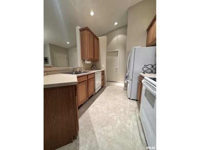 This duplex is located on fairway 15 at the Macomb Country Club on Macomb Country Club in Illinois - for sale on GolfHomes.com, golf home, golf lot