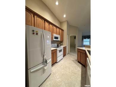 This duplex is located on fairway 15 at the Macomb Country Club on Macomb Country Club in Illinois - for sale on GolfHomes.com, golf home, golf lot