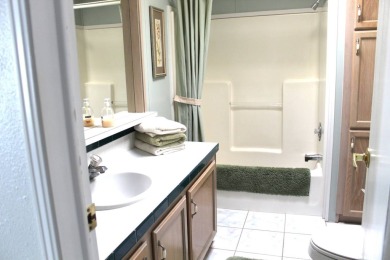 Enter the elegance of this beautifully manicured large 2-bedroom on Schalamar Creek Golf and Country Club in Florida - for sale on GolfHomes.com, golf home, golf lot