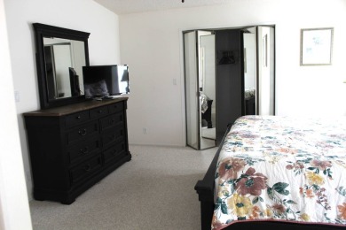 Enter the elegance of this beautifully manicured large 2-bedroom on Schalamar Creek Golf and Country Club in Florida - for sale on GolfHomes.com, golf home, golf lot