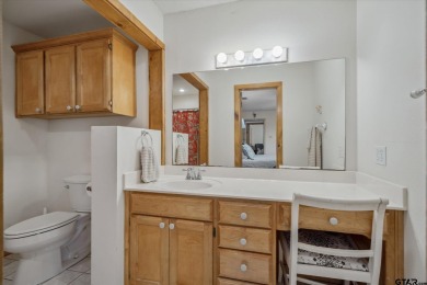 Beautifully maintained home in gated community. The cute covered on Holly Lake Ranch Golf Club in Texas - for sale on GolfHomes.com, golf home, golf lot
