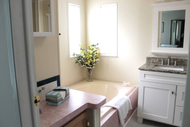 Enter the elegance of this beautifully manicured large 2-bedroom on Schalamar Creek Golf and Country Club in Florida - for sale on GolfHomes.com, golf home, golf lot