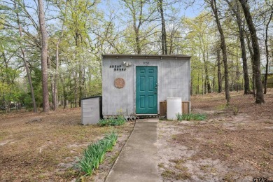 Beautifully maintained home in gated community. The cute covered on Holly Lake Ranch Golf Club in Texas - for sale on GolfHomes.com, golf home, golf lot