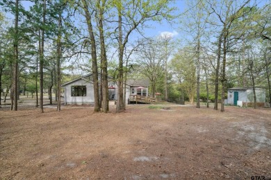 Beautifully maintained home in gated community. The cute covered on Holly Lake Ranch Golf Club in Texas - for sale on GolfHomes.com, golf home, golf lot