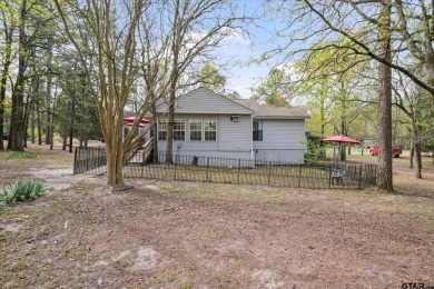 Beautifully maintained home in gated community. The cute covered on Holly Lake Ranch Golf Club in Texas - for sale on GolfHomes.com, golf home, golf lot