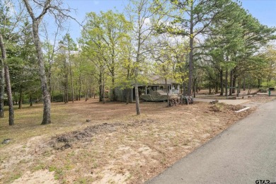 Beautifully maintained home in gated community. The cute covered on Holly Lake Ranch Golf Club in Texas - for sale on GolfHomes.com, golf home, golf lot