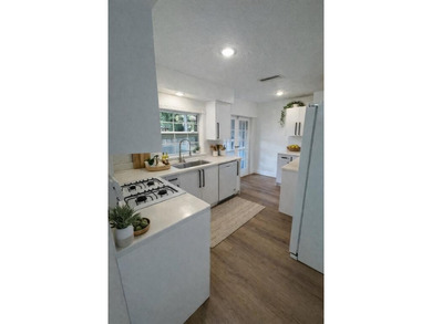 Beautifully remodeled 4-bedroom, 2-bath home located on a on Sunrise Lakes Phase III in Florida - for sale on GolfHomes.com, golf home, golf lot