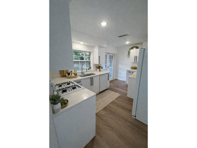 Beautifully remodeled 4-bedroom, 2-bath home located on a on Sunrise Lakes Phase III in Florida - for sale on GolfHomes.com, golf home, golf lot