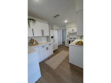 Beautifully remodeled 4-bedroom, 2-bath home located on a on Sunrise Lakes Phase III in Florida - for sale on GolfHomes.com, golf home, golf lot