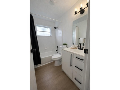 Beautifully remodeled 4-bedroom, 2-bath home located on a on Sunrise Lakes Phase III in Florida - for sale on GolfHomes.com, golf home, golf lot