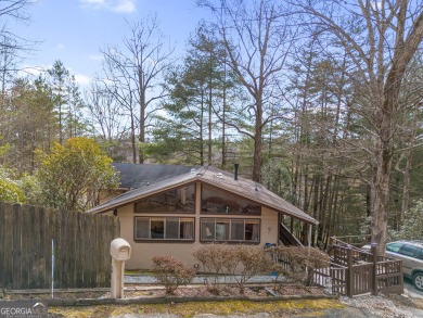 Nestled discreetly amid the pines, 9 Golf Drive, a corner lot on Rabun Golf Club in Georgia - for sale on GolfHomes.com, golf home, golf lot