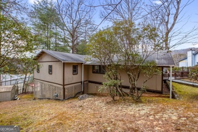 Nestled discreetly amid the pines, 9 Golf Drive, a corner lot on Rabun Golf Club in Georgia - for sale on GolfHomes.com, golf home, golf lot