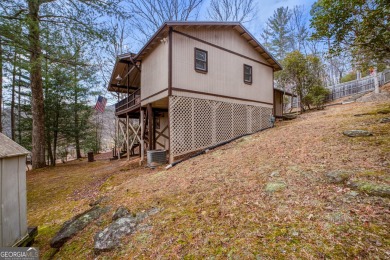 Nestled discreetly amid the pines, 9 Golf Drive, a corner lot on Rabun Golf Club in Georgia - for sale on GolfHomes.com, golf home, golf lot