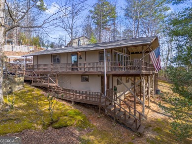 Nestled discreetly amid the pines, 9 Golf Drive, a corner lot on Rabun Golf Club in Georgia - for sale on GolfHomes.com, golf home, golf lot