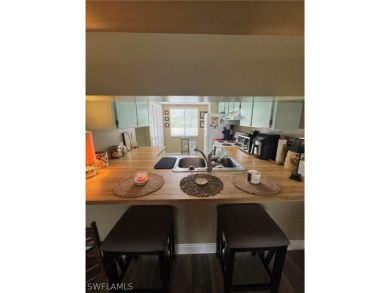 ATTENTION INVESTORS! This lovely 2nd floor, end-unit condo is on El Rio Golf Course and Club in Florida - for sale on GolfHomes.com, golf home, golf lot