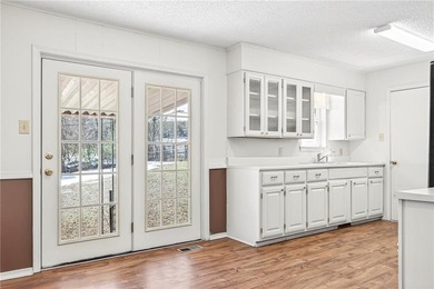 Welcome home to this well-maintained three bedroom, two bath on Cedars Country Club in Arkansas - for sale on GolfHomes.com, golf home, golf lot