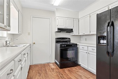 Welcome home to this well-maintained three bedroom, two bath on Cedars Country Club in Arkansas - for sale on GolfHomes.com, golf home, golf lot