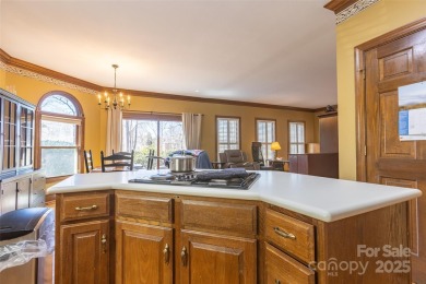 You'll love this full brick home in an amazing location on the on Cramer Mountain Country Club in North Carolina - for sale on GolfHomes.com, golf home, golf lot