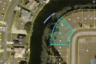 Oversized lot on a very large canal with a beautiful western on Burnt Store Golf Club in Florida - for sale on GolfHomes.com, golf home, golf lot