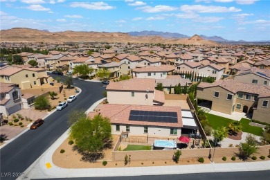 Paid-off solar panels and a prime corner lot with an expansive on Rhodes Ranch Golf Club in Nevada - for sale on GolfHomes.com, golf home, golf lot