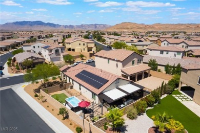 Paid-off solar panels and a prime corner lot with an expansive on Rhodes Ranch Golf Club in Nevada - for sale on GolfHomes.com, golf home, golf lot