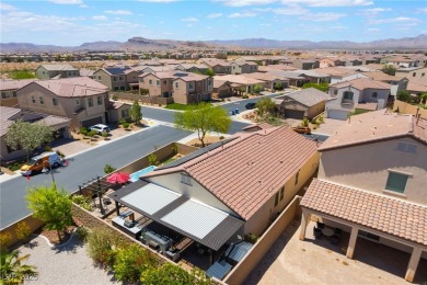 Paid-off solar panels and a prime corner lot with an expansive on Rhodes Ranch Golf Club in Nevada - for sale on GolfHomes.com, golf home, golf lot