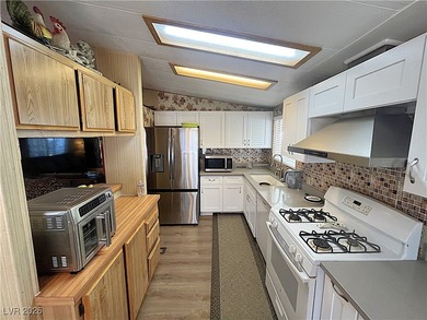 Welcome to your dreamy retreat in a vibrant 55+ community! This on Royal Links Golf Club in Nevada - for sale on GolfHomes.com, golf home, golf lot