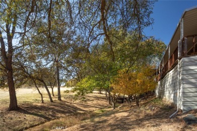 Cute, clean and affordable manufactured home that backs up to on Lake Oroville Golf and Event Center in California - for sale on GolfHomes.com, golf home, golf lot