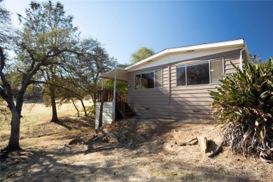 Cute, clean and affordable manufactured home that backs up to on Lake Oroville Golf and Event Center in California - for sale on GolfHomes.com, golf home, golf lot