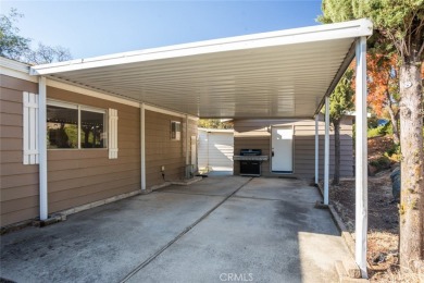 Cute, clean and affordable manufactured home that backs up to on Lake Oroville Golf and Event Center in California - for sale on GolfHomes.com, golf home, golf lot