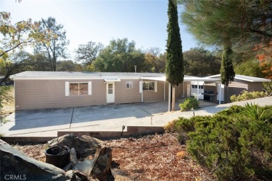 Cute, clean and affordable manufactured home that backs up to on Lake Oroville Golf and Event Center in California - for sale on GolfHomes.com, golf home, golf lot